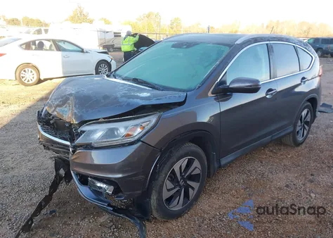 2015 Honda Cr-V Touring z USA, uszkodzony, nr VIN 5J6RM3H90FL020766